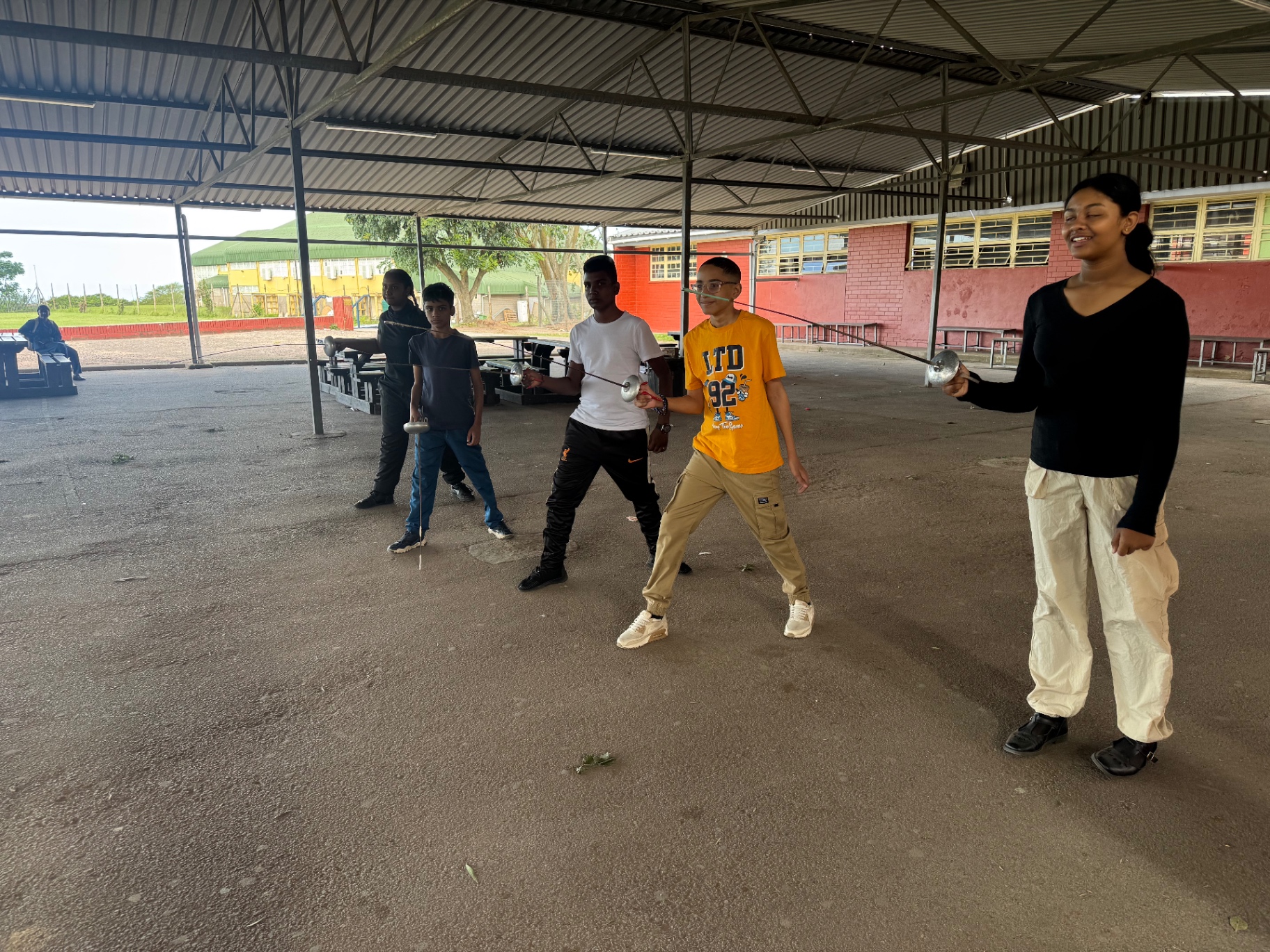 Young fencers training with fencing weapons at a KZN development hub