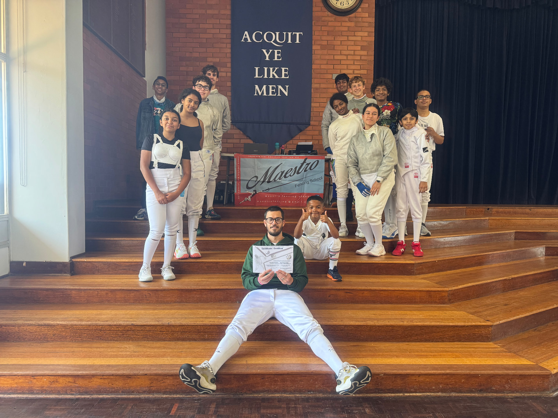 Fencers gathered around the Maestro Fencing School banner at Northwood School during the 2026 KZN Championships