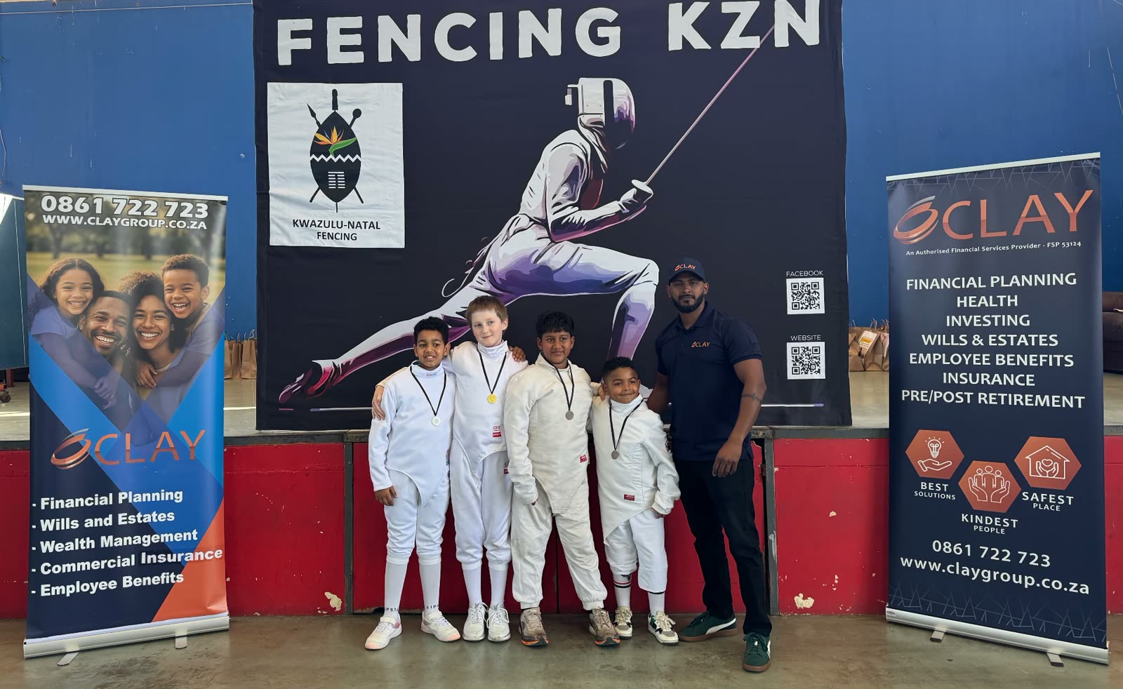 Young fencers with medals alongside a Clay Group representative at KZN Ranking 3